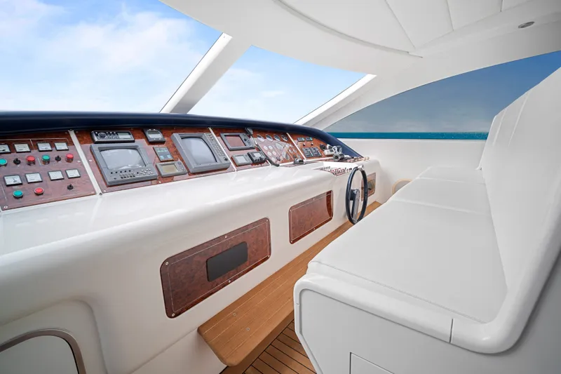 Slide: The Image of Cockpit of 2007 Mangusta 72 Motor Yacht with modern controls and ocean view. - 21