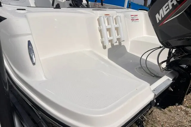 Slide: The Image of 2024 Bayliner Element M15 boat stern with Mercury outboard motor. - 2