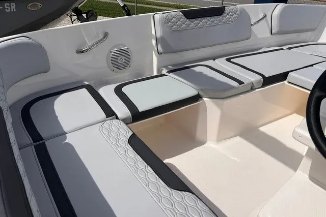 Slide: The Image of 2024 Bayliner Element M15 boat interior with cushioned seating and modern design. - 6