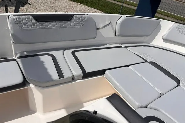 Slide: The Image of 2024 Bayliner Element M15 boat interior with cushioned seating and modern design. - 7