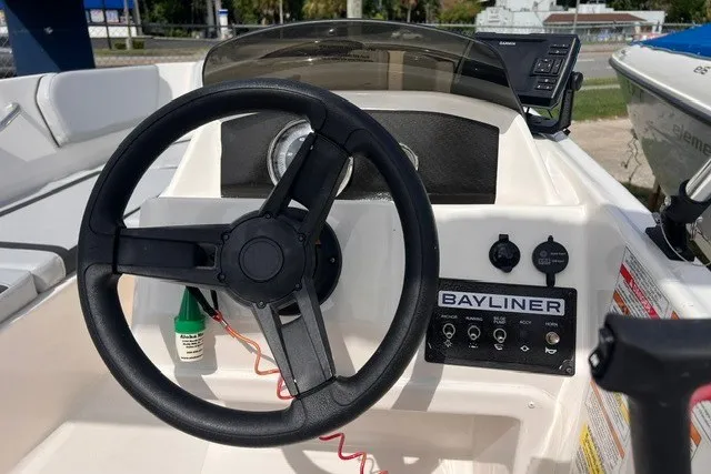 Slide: The Image of Steering console of 2024 Bayliner Element M15 boat with controls and dashboard. - 4