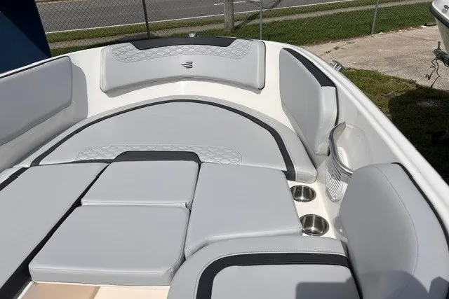 Slide: The Image of 2024 Bayliner Element M15 boat interior with gray seating and cup holders. - 10