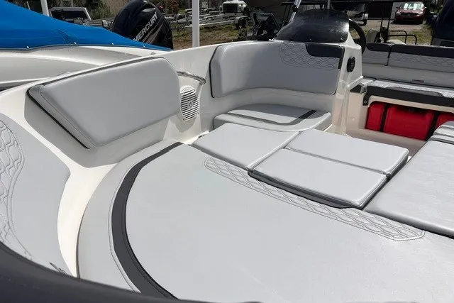 Slide: The Image of 2024 Bayliner Element M15 boat interior with gray seating and storage compartments. - 11