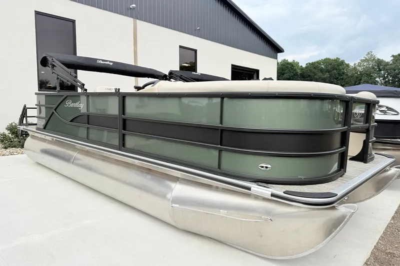 The Image of 2027 Bentley Pontoons FISH 200 FISH-N-CRUISE pontoon boat, green and black, docked outdoors. - 1