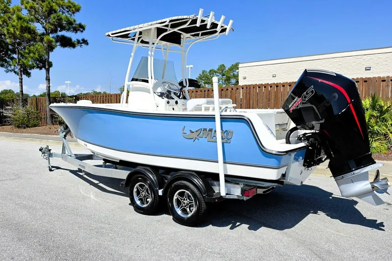 Slide: The Image of 2026 Mako 214 Center Console boat on trailer, featuring sleek design and powerful engine. - 13