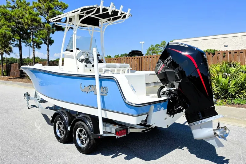 Slide: The Image of 2026 Mako 214 Center Console boat on trailer, featuring sleek design and powerful outboard motor. - 14