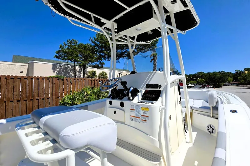 Slide: The Image of 2026 Mako 214 Center Console boat with sleek design and modern controls. - 20