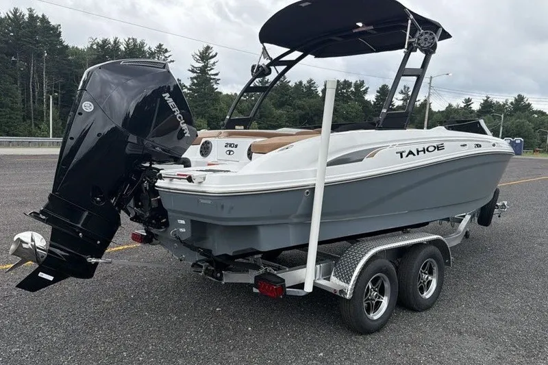Slide: The Image of 2026 Tahoe 210 S boat on trailer with Mercury outboard motor in parking lot. - 5