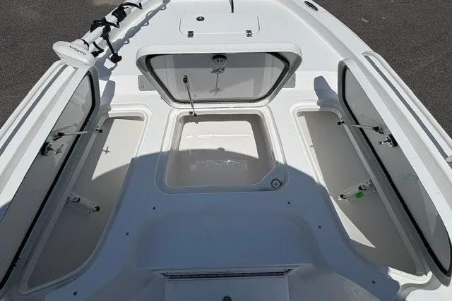 Slide: The Image of 2026 Sea Hunt BX25FS boat storage compartments, open and spacious, showcasing ample storage capacity. - 17