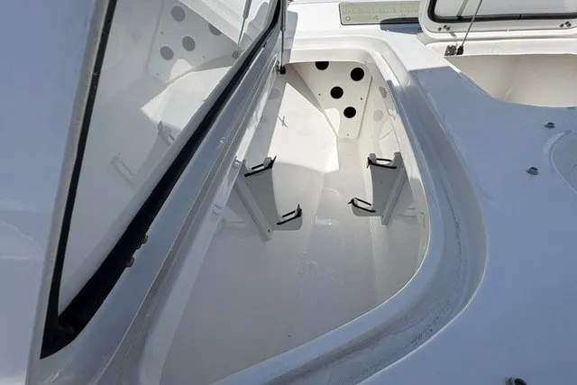 Slide: The Image of Open storage compartment on 2026 Sea Hunt BX25FS boat, showcasing spacious interior design. - 16