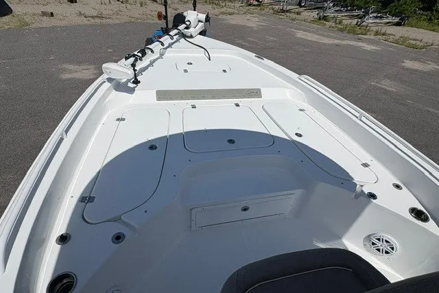 Slide: The Image of 2026 Sea Hunt BX25FS boat deck with storage compartments and trolling motor. - 14