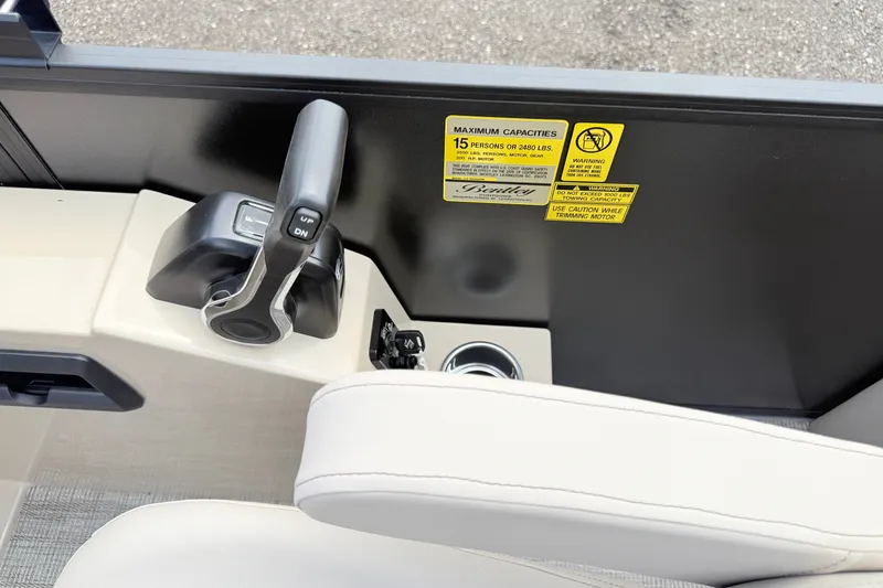 Slide: The Image of Control panel of 2027 Bentley Pontoons Legacy 223 DL Navigator with capacity warning label. - 19