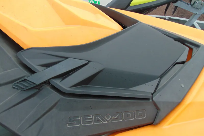 Slide: The Image of 2015 Sea-Doo Spark 2up, close-up of orange and black seat design. - 11
