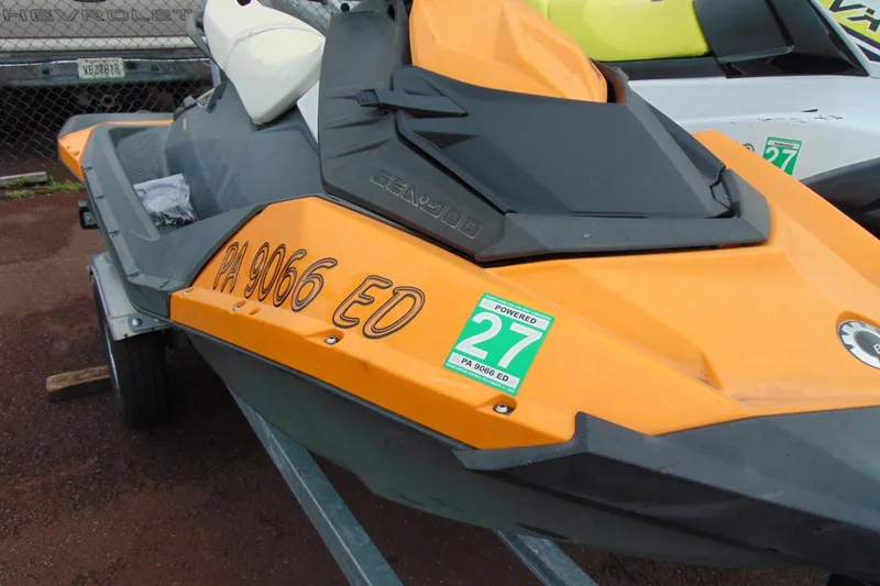 Slide: The Image of 2015 Sea-Doo Spark 2up jet ski in orange, parked on a trailer. - 12