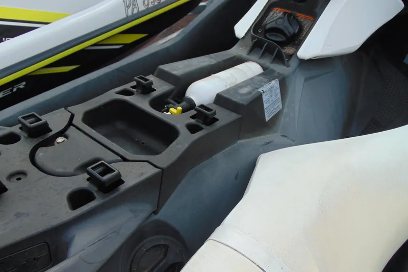 Slide: The Image of 2015 Sea-Doo Spark 2up interior showing storage compartment and controls. - 9