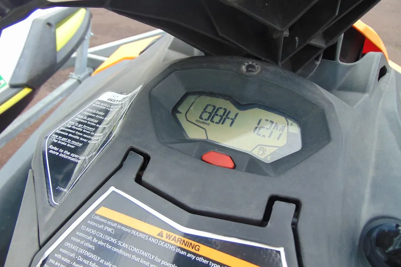 Slide: The Image of Dashboard of a 2015 Sea-Doo Spark 2up showing digital display and warning labels. - 8