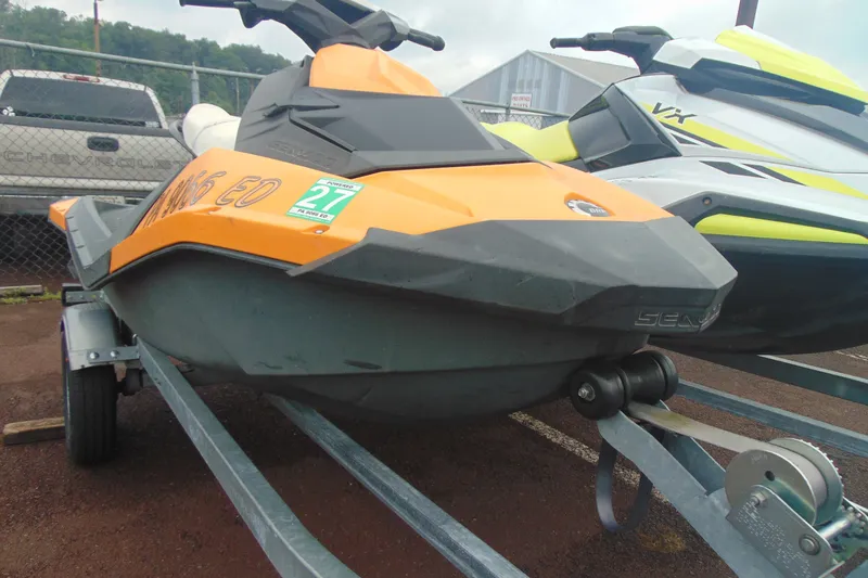 Slide: The Image of 2015 Sea-Doo Spark 2up jet ski on trailer, parked outdoors. - 3