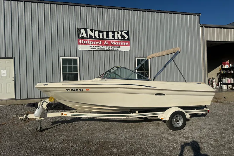 The Image of 2000 Searay 180 boat on trailer at Anglers Outpost & Marine dealership. - 1