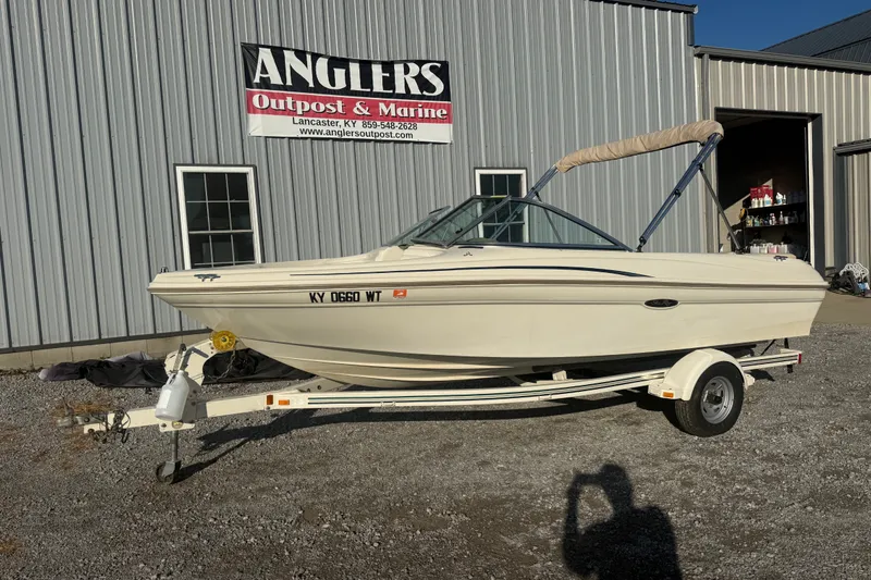 Slide: The Image of 2000 Searay 180 boat on trailer outside Angler's Outpost & Marine building. - 5