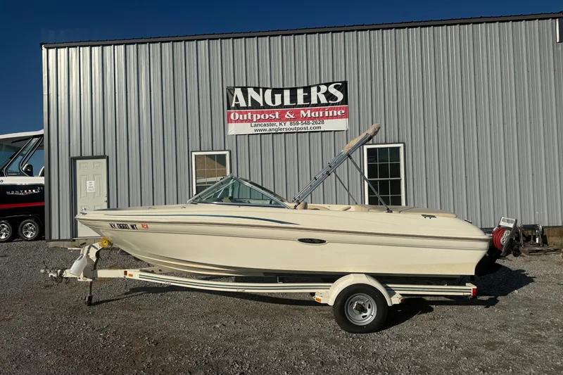 Slide: The Image of 2000 Searay 180 boat on trailer at Anglers Outpost & Marine dealership. - 2