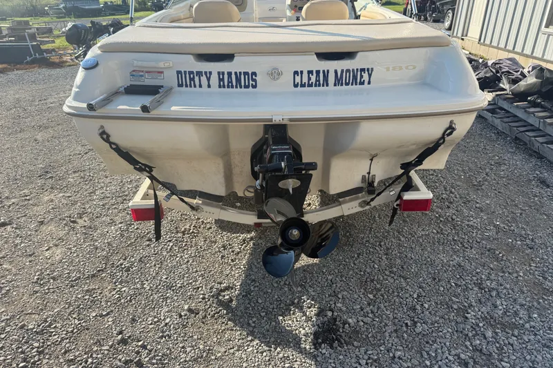 Slide: The Image of Rear view of 2000 Searay 180 boat with "Dirty Hands Clean Money" text. - 8
