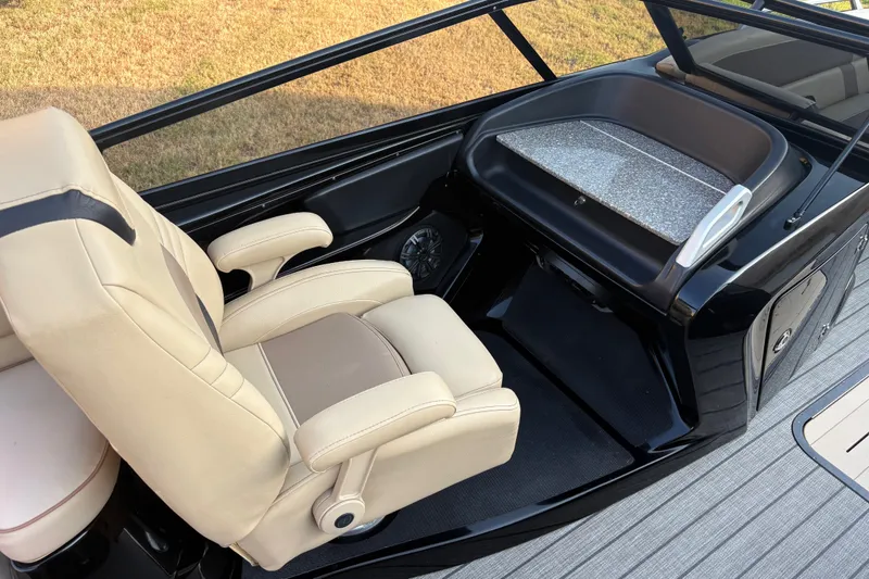 Slide: The Image of Luxurious SunCatcher Amara 2019 boat interior with beige captain's chair and sleek dashboard. - 15