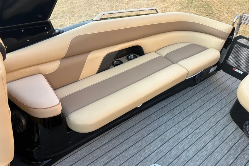 Slide: The Image of Luxurious beige seating on 2019 SunCatcher Amara boat, featuring sleek design and cup holders. - 17