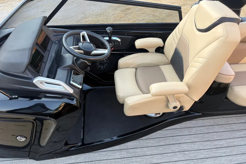 Slide: The Image of Captain's seat and helm of 2019 SunCatcher Amara boat, featuring modern controls and beige upholstery. - 13