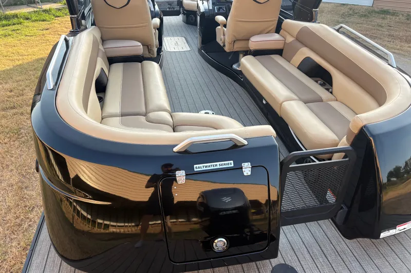 Slide: The Image of Luxurious 2019 SunCatcher Amara boat interior with beige seating and sleek black exterior. - 20