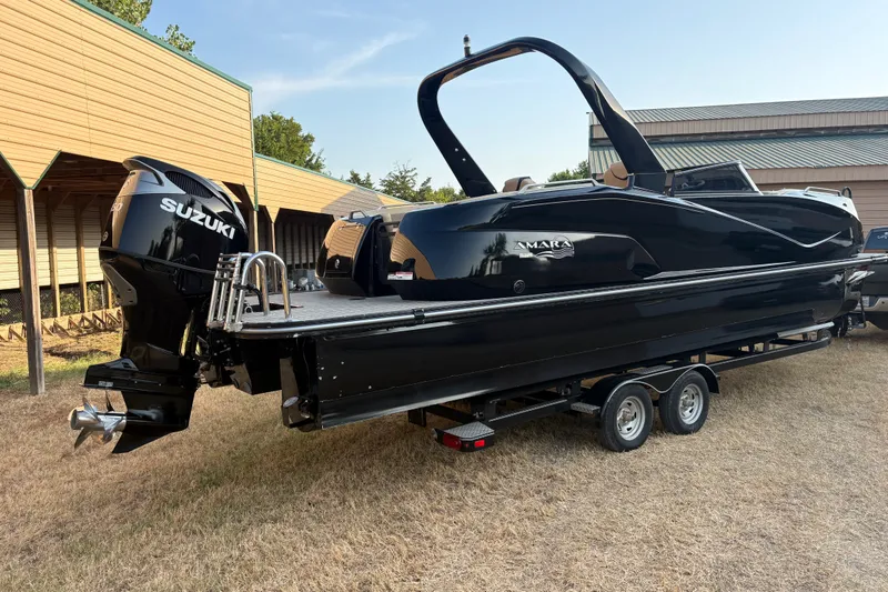 Slide: The Image of 2019 SunCatcher Amara boat with Suzuki engine on trailer, parked outdoors. - 4