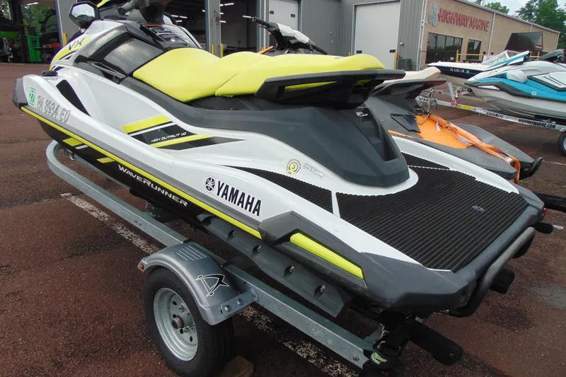 Slide: The Image of 2021 Yamaha WaveRunner VX on trailer, featuring sleek design and vibrant yellow seat. - 12