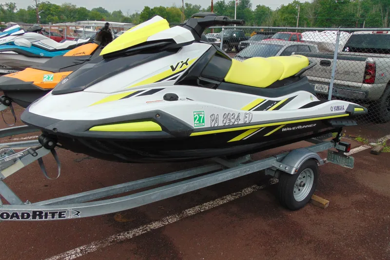Slide: The Image of 2021 Yamaha WaveRunner VX on trailer, parked in a lot with other watercraft. - 3