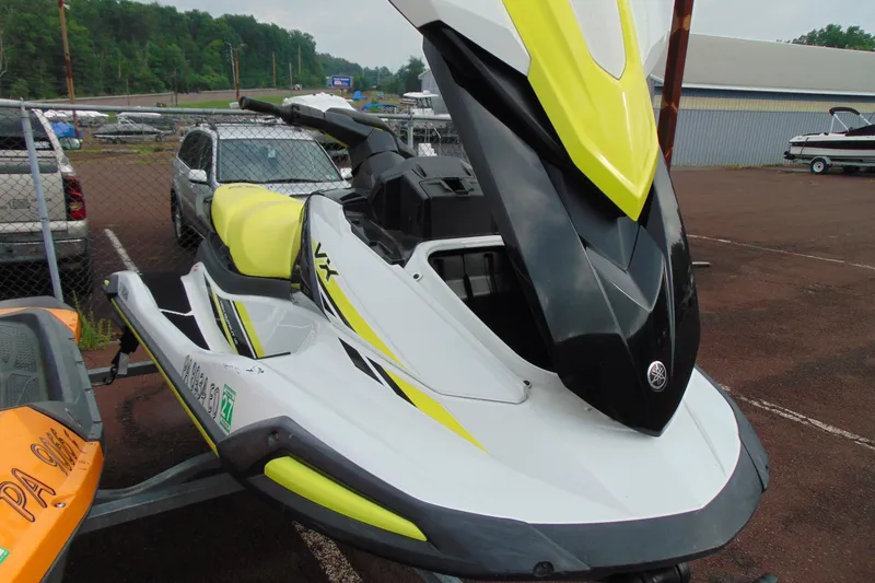 Slide: The Image of 2021 Yamaha WaveRunner VX in a parking lot, featuring sleek yellow and black design. - 10