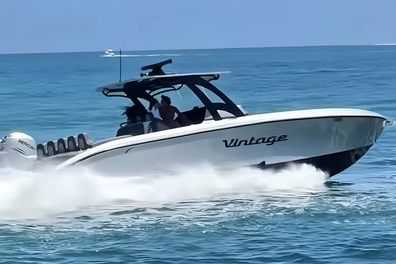 Slide: The Image of 2021 Midnight Express 37 Open boat speeding on ocean waters. - 3