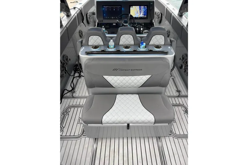 Slide: The Image of 2021 Midnight Express 37 Open boat interior with luxury seating and modern dashboard. - 14