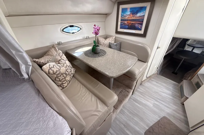 Slide: The Image of Luxurious interior of 1999 Maxum 3300 SCR yacht with elegant seating and decor. - 45