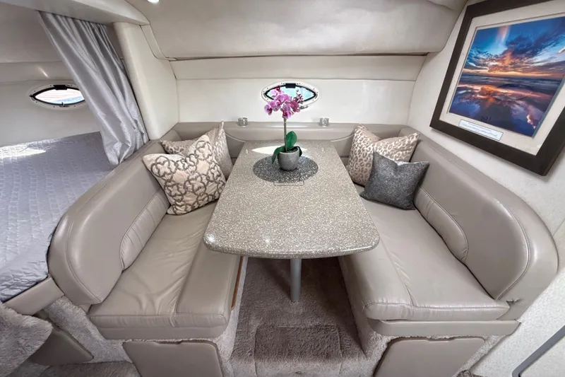 Slide: The Image of Luxurious interior of 1999 Maxum 3300 SCR yacht with elegant seating and decor. - 38