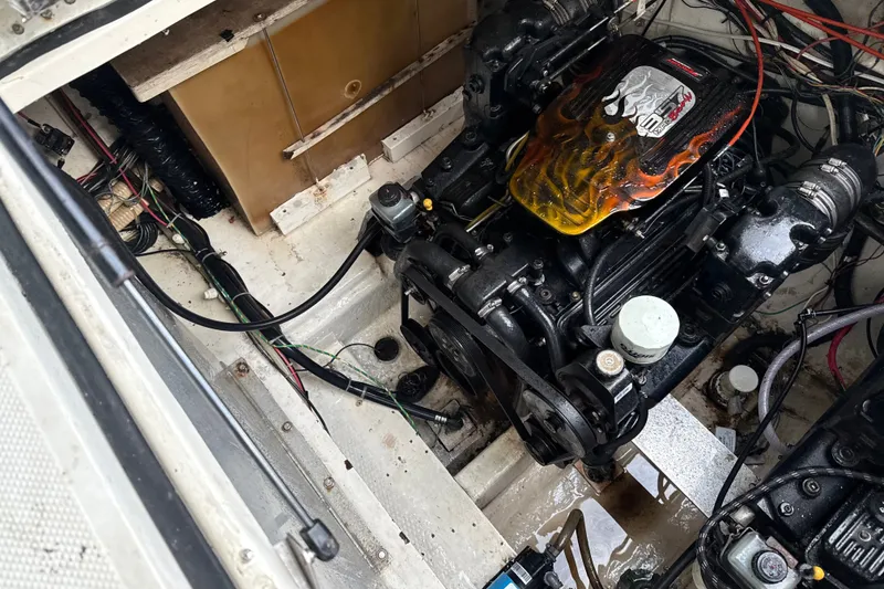 Slide: The Image of Engine compartment of a 1999 Maxum 3300 SCR boat, showcasing detailed mechanics. - 65