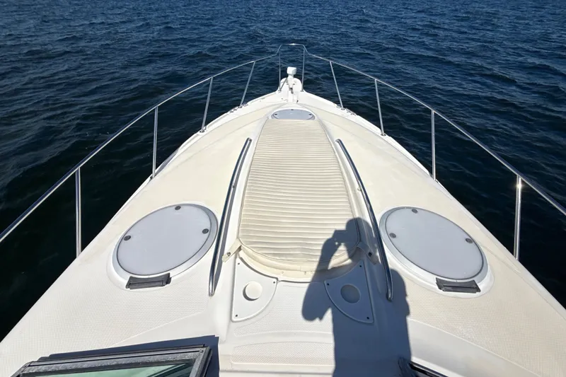 Slide: The Image of 1999 Maxum 3300 SCR boat deck with ocean view and shadow. - 56