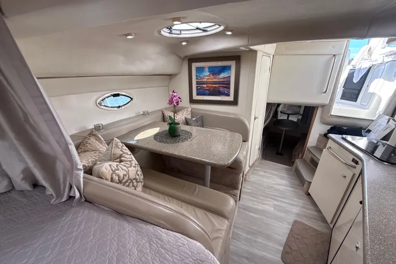 Slide: The Image of Luxurious interior of 1999 Maxum 3300 SCR yacht with dining area and modern decor. - 43