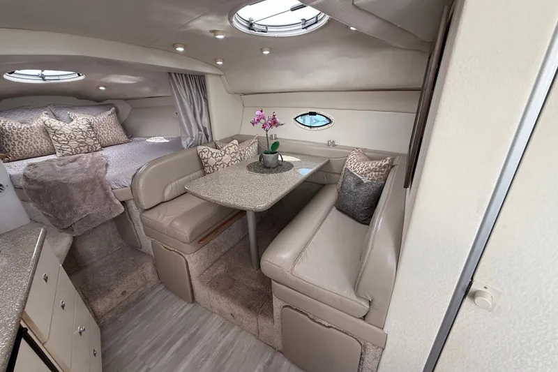 Slide: The Image of Luxurious interior of 1999 Maxum 3300 SCR yacht with cozy seating and elegant decor. - 30