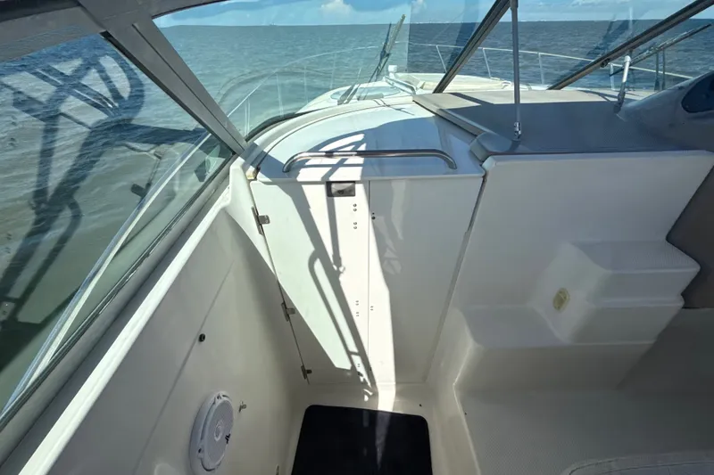 Slide: The Image of 1999 Maxum 3300 SCR boat interior with ocean view through windshield. - 27