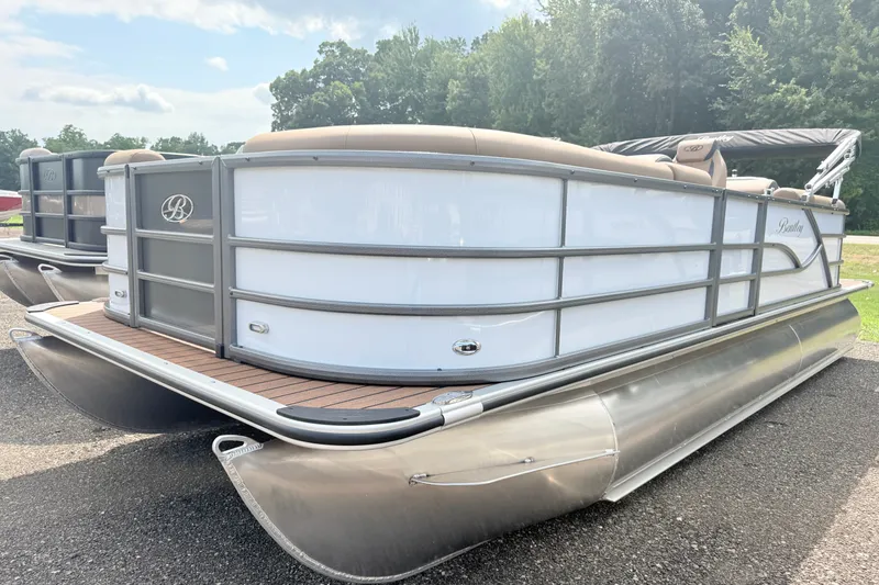 The Image of 2027 Bentley Pontoons Legacy 220 Navigator, sleek design, parked outdoors. - 1