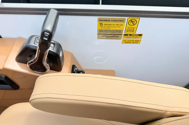 Slide: The Image of 2027 Bentley Pontoons Legacy 220 Navigator control panel with capacity warning label. - 14