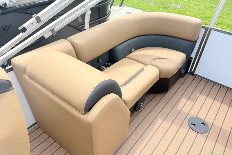 Slide: The Image of Luxurious seating on 2027 Bentley Pontoons Legacy 220 Navigator, featuring tan and black upholstery. - 15