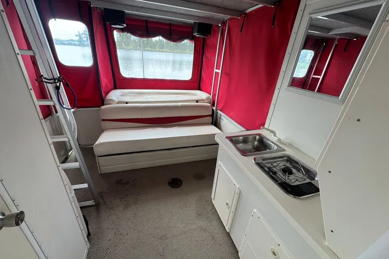Slide: The Image of 2008 Sun Tracker Party Hut 30 I/O Regency Edition interior with red curtains and kitchenette. - 21