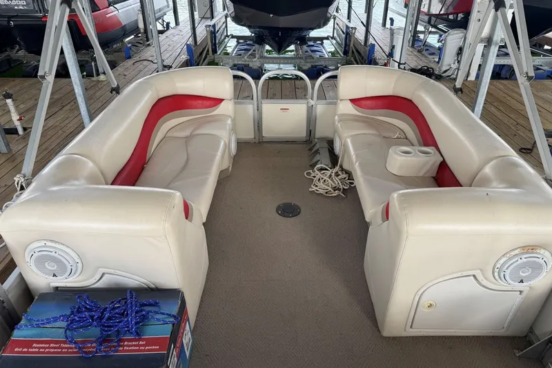 Slide: The Image of 2008 Sun Tracker Party Hut 30 I/O Regency Edition interior with beige and red seating. - 19