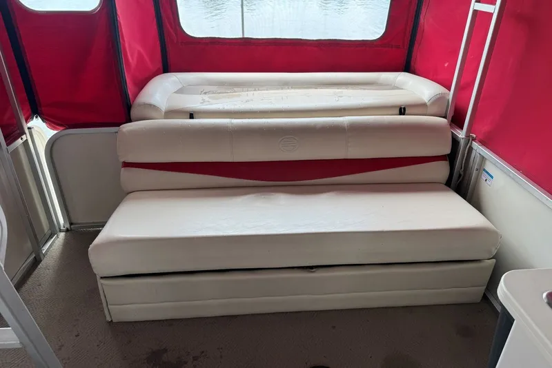 Slide: The Image of 2008 Sun Tracker Party Hut 30 I/O Regency Edition interior with red and white seating. - 24
