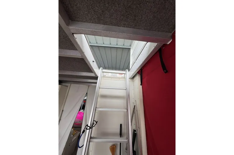Slide: The Image of Interior view of 2008 Sun Tracker Party Hut 30 I/O Regency Edition with ladder access. - 30