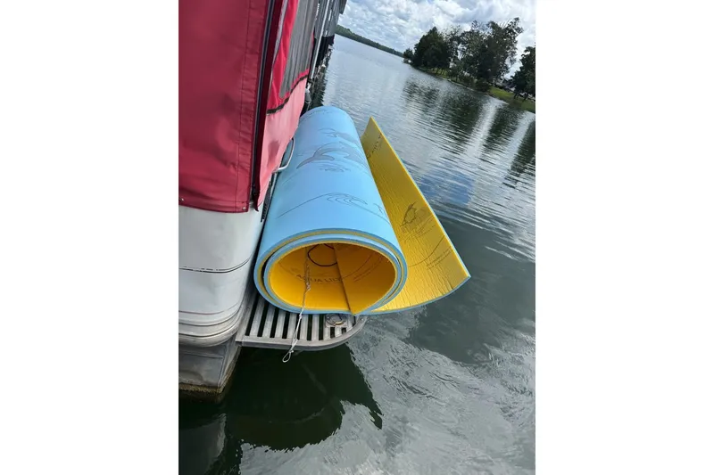 Slide: The Image of 2008 Sun Tracker Party Hut 30 I/O with rolled floating mat on lake. - 33